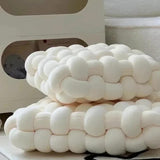 Weighted sensory cushion, a cushion providing deep pressure